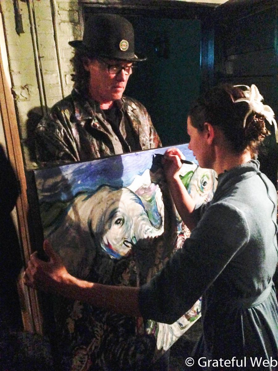 Bonnie Paine autographs a Scramble Campbell painting