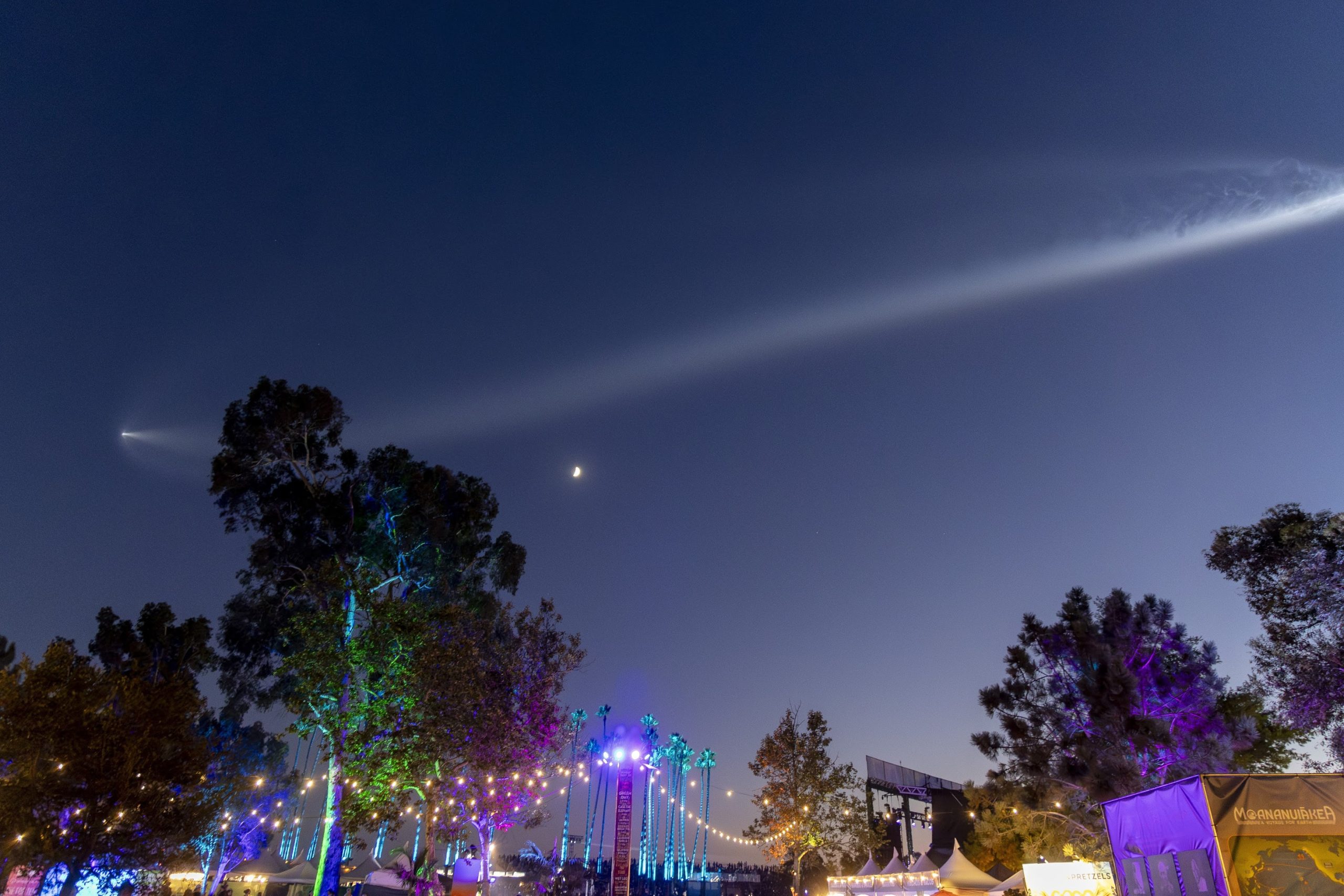 SpaceX Falcon 9 flying over the top of the fest