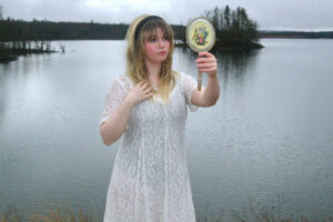 Sabrina Trueheart steps through the neon mirror on “Alice in Videoland”