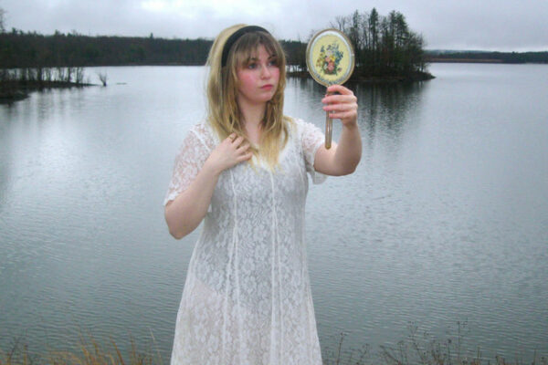 Sabrina Trueheart steps through the neon mirror on “Alice in Videoland”